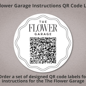 May include: A circular white label with a black wavy border and the text "THE FLOWER GARAGE" above a QR code. The text "The Flower Garage Instructions QR Code Labels" is at the top, and "Order a set of designed QR code labels for instructions for the The Flower Garage" is at the bottom.