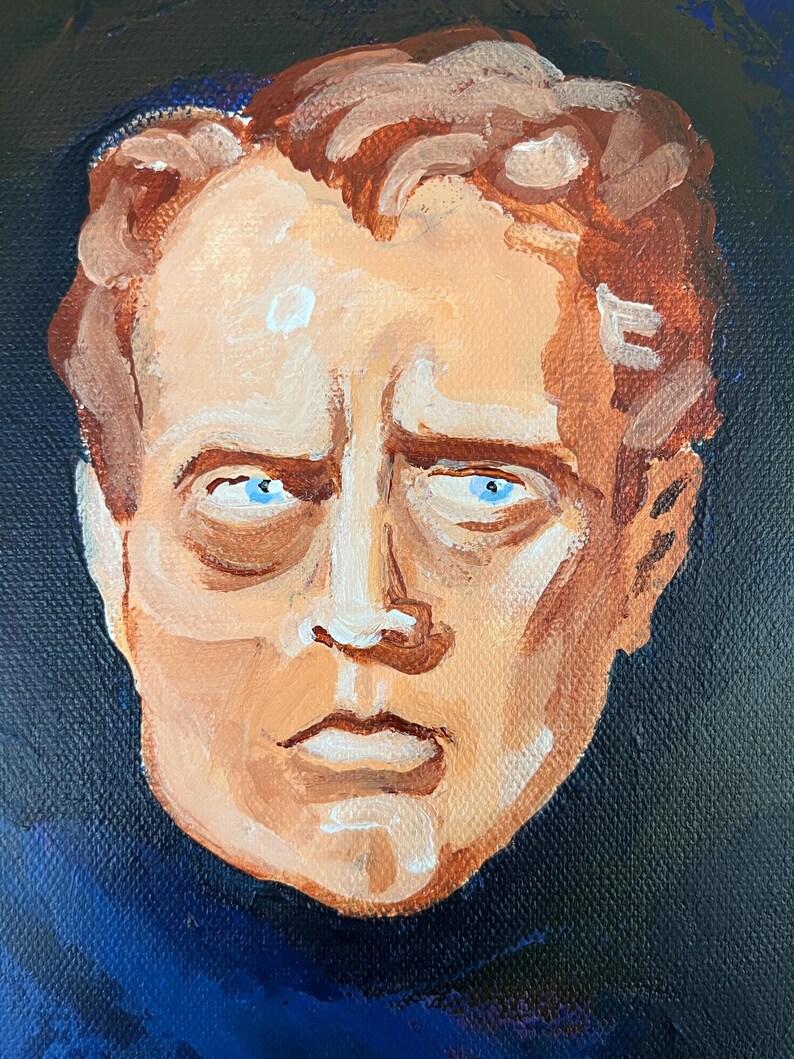 May include: An oil painting of a man's face with a serious expression. The portrait features a light skin tone, blue eyes, and reddish-brown hair. The background is a dark blue.
