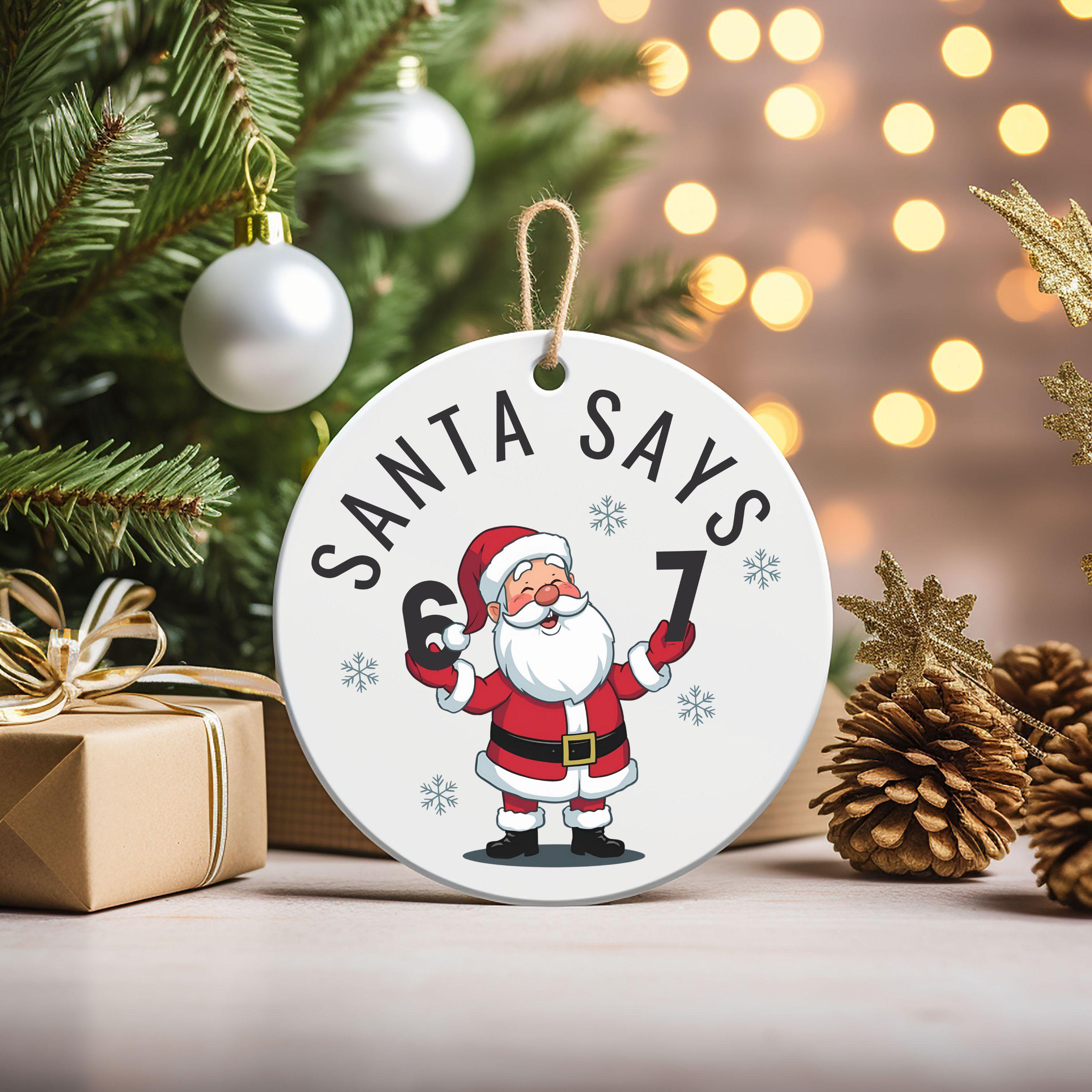 Discover Santa Says 6 7 Christmas Ornament, Funny Number Meme Tree Decoration, Kid Gift, Gen Alpha Humor Ceramic Ornament