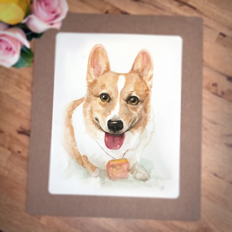 May include: Watercolor painting of a corgi dog with a happy expression, wearing a tag with a paw print design. The dog is painted in shades of brown, white, and orange.