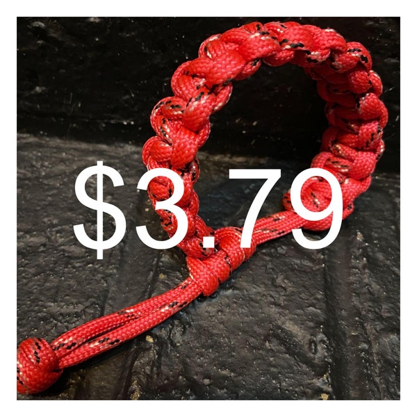 Red survival paracord rope bracelet with adjustable slide for men and women