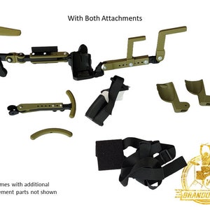 May include: A green and black drum throne attachment with a strap and multiple adjustable parts. The text "With Both Attachments" is visible at the top of the image. The text "*Comes with additional replacement parts not shown" is visible at the bottom of the image.