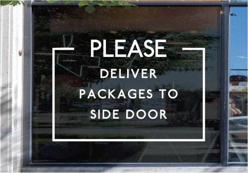 May include: A white vinyl decal applied to a glass window featuring the text PLEASE DELIVER PACKAGES TO SIDE DOOR enclosed within a rectangular border. The lettering is in a clean, sans-serif font, providing clear instructions for delivery personnel.