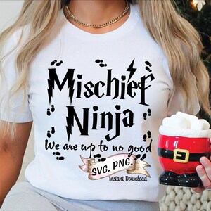 May include: White t-shirt with black text that reads "Mischief Ninja" and "We are up to no good". The text is in a whimsical font and includes a lightning bolt and footprints. The shirt also has a pink and white ribbon with the text "SVG. PNG. Instant Download".