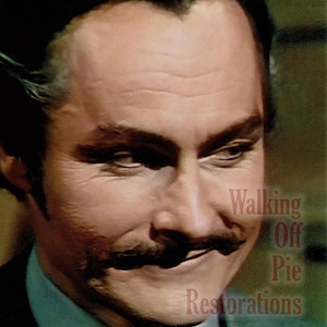 May include: Close-up of a man with a mustache, looking to the side. The image has a vintage aesthetic, with the text "Walking Off Pie Restorations" in the lower right corner.