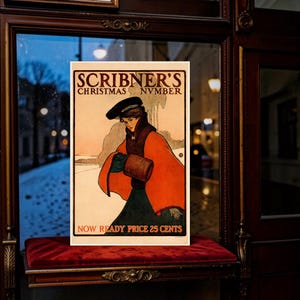 May include: A vintage-style rectangular poster titled Scribner's Christmas Nvmber. It features an illustration of a person wearing a dark hat, a bright orange cape, and a dark green skirt, holding a brown muff against a snowy landscape background.