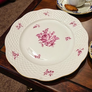 May include: A set of three ceramic mugs with a speckled, matte finish. The mugs are in shades of cream, light gray, and dark gray. Each mug has a simple, minimalist design and a rounded handle.