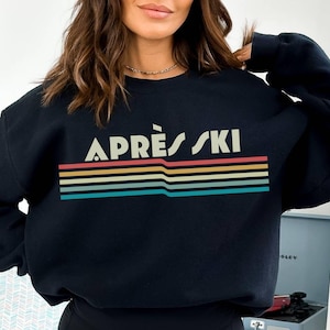 Apres ski retro 80's rainbow, vintage design with Apres Ski written over rainbow swish Apres ski sweatshirt is great gift or christmas present for a skiier or white christmas apres ski lover. cozy comfy trendy preppy top