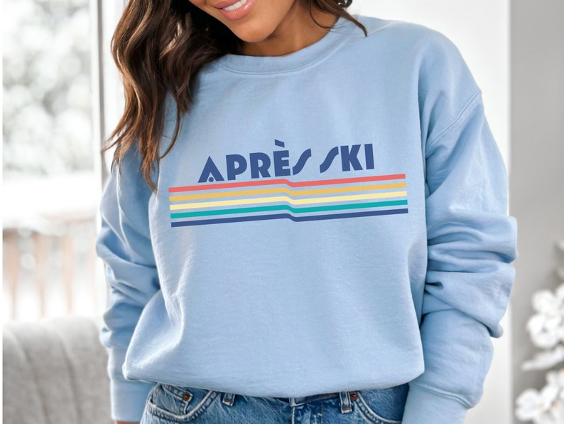 Apres ski retro 80's rainbow, vintage design with Apres Ski written over rainbow swish Apres ski sweatshirt is great gift or christmas present for a skiier or white christmas apres ski lover. cozy comfy trendy preppy top