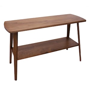 May include: A brown wooden console table with a lower shelf. The table has a simple, mid-century modern design with angled legs.