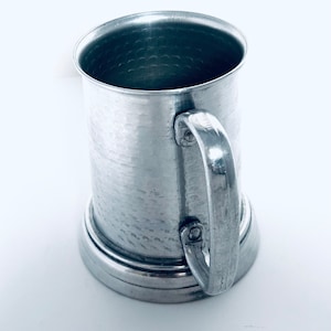 Vintage silver plated pewter tankard with clear bottom stamped Hong Kong