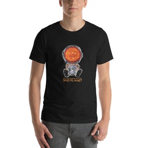 May include: A black t-shirt with a graphic of an astronaut with the sun in their helmet. The text "My favorite is the 3rd planet" is printed below the astronaut.