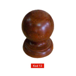 May include: A dark brown wooden finial with a round top and a slightly flared base. The finial is a decorative element used on furniture, curtains, and other objects.