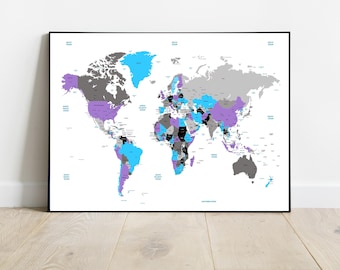 May include: A framed world map with countries colored in shades of gray, purple, blue, and black. The map is set against a white background and framed in black. The oceans are labeled in blue text. The map is displayed on a light wood floor.