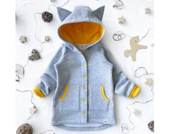 May include: Gray hooded sweatshirt with yellow accents, featuring a button-up front, two pockets, and cat ears on the hood.
