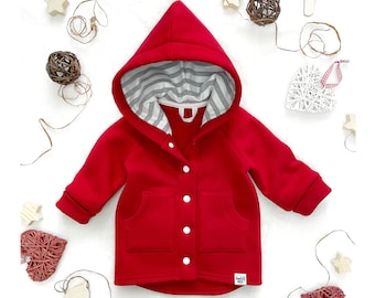 May include: Red hooded jacket with a white and gray striped lining, button closure, and two front pockets.