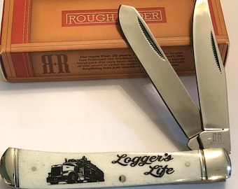 LOG TRUCK picture  with “Loggers Life”  on front handle.. NEW in box… 2 blade trapper style