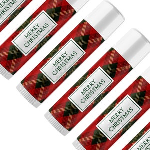 May include: Five red and black plaid lip balm tubes with white caps. Each tube has a white label with green text that reads "Merry Christmas".