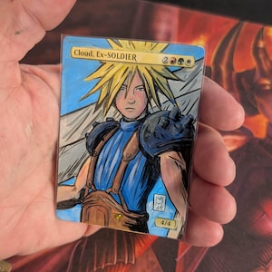 May include: A hand-painted trading card featuring the character Cloud, Ex-SOLDIER, with spiky blonde hair and a blue outfit. The card has a blue sky background and the text "Cloud, Ex-SOLDIER" at the top. The card is marked 4/4.