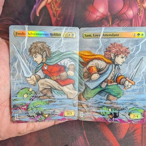 frodo adventurous hobbit mtg card MTG: The Lord of the Rings: Frodo, Foil #0002 Mythi Collector's Kingdom Adventurous Hobbit attacks Frodo, hobbit aventurero MTG -