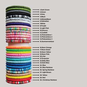 May include: A stack of colorful polymer clay disc bracelets in various colors, including dark green, black, white and black, pink rainbow, and neon orange. The image includes a numbered list of the colors.