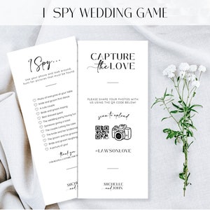 May include: Two black and white printable cards for a wedding game. The first card says "I Spy..." and has a list of things to find at the wedding. The second card says "Capture the Love" and has a QR code and the hashtag #LAWSONLOVE.