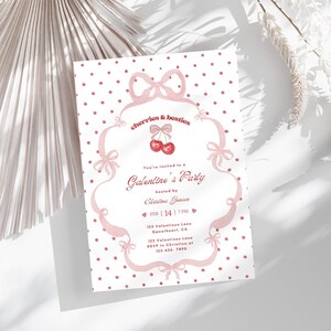 May include: A pink and white Galentine's Party invitation with a polka dot background. The invitation features the text "cherries & besties" and "Galentine's Party". The date is February 14th at 7 PM.
