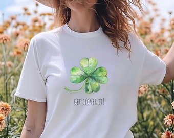 May include: White t-shirt with a green four-leaf clover graphic and the text "GET CLOVER IT!"