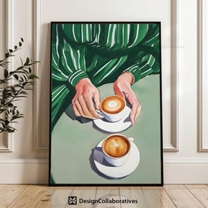 May include: A painting of two cups of coffee with latte art on a green and white striped background. The cups are sitting on white saucers. The hands of a person wearing a green and white striped shirt are visible in the image.