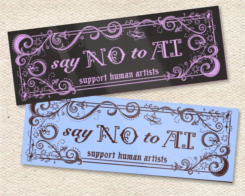 May include: Two rectangular stickers with ornate floral borders. One is black with lavender accents and the text "say NO to AI, support human artists." The other is light blue with brown accents and the same text.