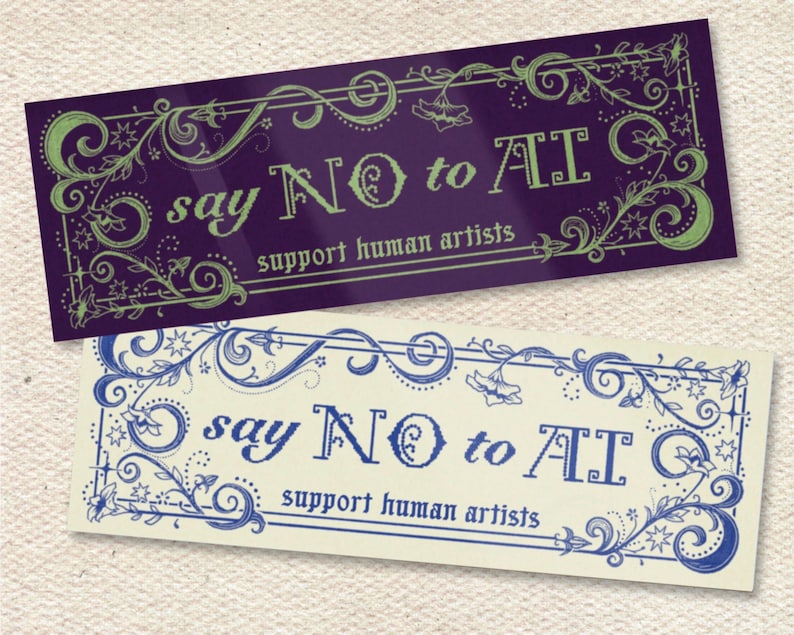May include: Two rectangular stickers with ornate floral borders. One is purple with green text that reads "say NO to AI, support human artists." The other is cream with blue text that reads the same.