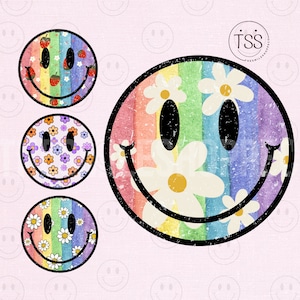 Peut inclure: Quatre designs différents de visage souriant avec un fond arc-en-ciel. Les designs comprennent un arc-en-ciel avec des fraises, un arc-en-ciel avec des marguerites, un arc-en-ciel avec de petites fleurs et un arc-en-ciel avec de grandes marguerites.