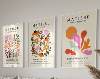 May include: Three framed art prints with colorful abstract floral designs. The prints are titled "Matisse" and feature the text "Papiers Decoupes" and "Berggruen & Cie".