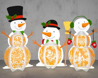May include: Three white snowman-shaped paper lanterns with orange and white designs. The lanterns have a festive Christmas theme with text that reads "Merry Grinchmas" and "Ho Ho Hos".