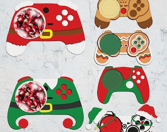 May include: Five different Christmas-themed game controller designs. Each controller is decorated with a different holiday theme, including Santa, gingerbread, and an elf. The controllers are all in the shape of a traditional game controller, with buttons and joysticks.