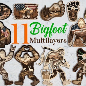 Könnte beinhalten: Eine Sammlung von 11 mehrschichtigen Wandkunstobjekten aus Holz zum Thema Bigfoot, die verschiedene Motive wie Silhouetten der Kreatur, amerikanische Flaggen, Berglandschaften, Wälder, Hirsche und Angelszenen mit dem Text 11 Bigfoot Multilayers zeigen.