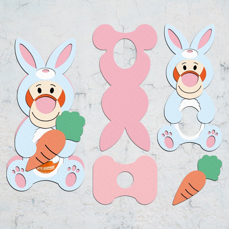 May include: A set of printable bunny and bear cutouts. The bunny is light blue with a carrot and the text "with surprise". The bear is pink and has a hole in the middle.