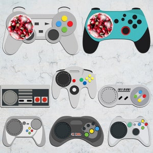 May include: A collection of nine different colorful video game controllers, including a classic Nintendo controller, a Playstation controller, and a Sega Genesis controller.