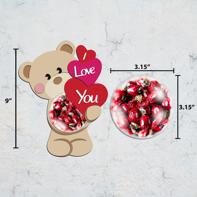 May include: A beige teddy bear cutout holding three red and pink hearts with the words "I Love You". The bear is 9 inches tall. A 3.15-inch round glass ornament filled with red candies is next to the bear.