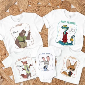 Puede incluir: Camisetas blancas y un body para bebé con personajes de dibujos animados de Zootopia. Las camisetas muestran a Flash el perezoso, Gary DeShake la serpiente, Nick Wilde el zorro, Judy Hopps la coneja y Finnick el fénec. Cada diseño está enmarcado.