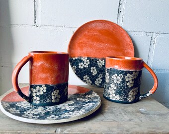 Cup with floral pattern and matching round plate, black-orange stoneware cup, motif cup, cup, stoneware mug