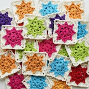 May include: A collection of colorful, crocheted granny squares in various shades including yellow, orange, pink, blue, green, and red. Each square features a starburst design and is bordered with white yarn. A ball of yarn and a crochet hook are also visible.