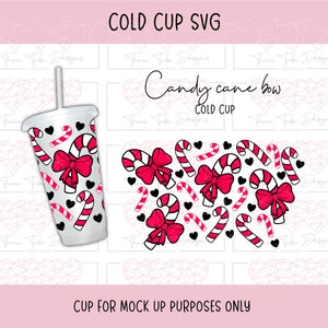 May include: A white cold cup with a design of candy canes and red bows. The text "Candy cane bow" and "Cold Cup" is on the cup.
