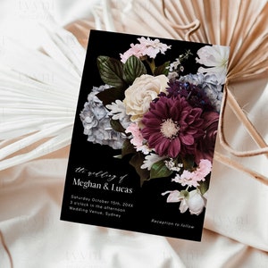 May include: A black wedding invitation with a floral design featuring white, pink, and burgundy flowers. The text on the invitation reads "the wedding of Meghan & Lucas, Saturday October 15th, 20XX, 3 o'clock in the afternoon, Wedding Venue, Sydney, Reception to follow."