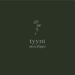 May include: A simple line drawing of a flower with the text "tyyni mockups" below it. The background is a dark green color.