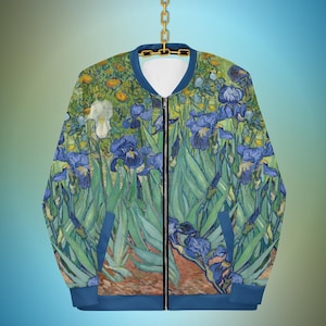 May include: A blue bomber jacket with a full-color print of Vincent van Gogh's "Irises" painting. The print features blue, yellow, green, and white irises.