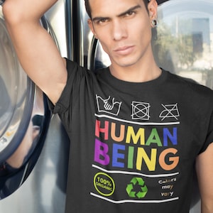 HUMAN BEING - Colors May Vary Unisex T-Shirt | Anti Racism - Anti Homophobia T shirt | Black Lives Matter T shirt | LGBTQ Gay Pride T shirt