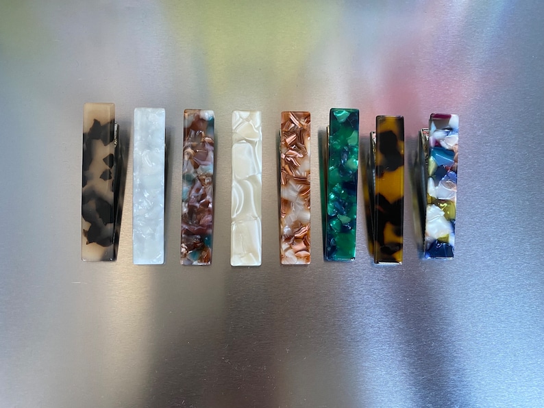 set of colorful acetate French hair clips in eight vibrantpatterns.