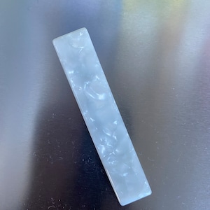 Glossy pearl hair slides for elegant or casual hair styles.