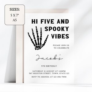 May include: Black and white Halloween party invitation with a skeleton hand graphic. The text reads "Hi Five and Spooky Vibes". It's for Jacob's 5th birthday party on August 21st at 2:00 PM. The address is 567 Houston Street, Town, State 123. RSVP to Amanda at 123-456-7890.